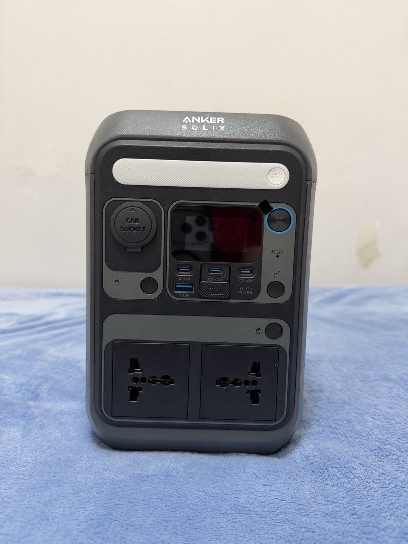 Anker Solix Portable Power Station (Category: Batteries & Power Banks) located in Malolos. Submitted by jaizemndz22 (Listing ID 1470274377, Image 1). Description: - Brand/Model: Anker Solix Power Station - Color: Sleek Grey casing - Power Output: 2 AC sockets, 1 car socket, 3 USB-C ports, and 1 USB-A port - Display & Lighting: Central digital status screen and built-in top-front LED light panel - Cooling & Charging: Side and back cooling vents wi