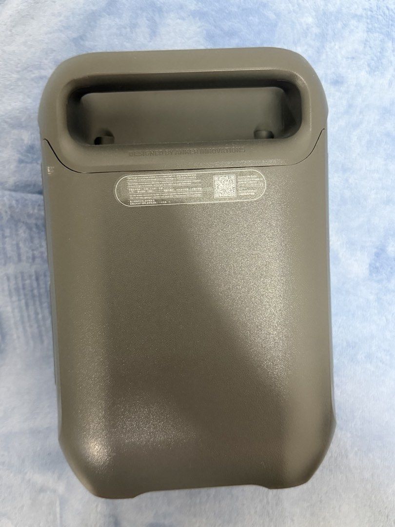 Anker Solix Portable Power Station (Category: Batteries & Power Banks) located in Malolos. Submitted by jaizemndz22 (Listing ID 1470274377, Image 3). Description: - Brand/Model: Anker Solix Power Station - Color: Sleek Grey casing - Power Output: 2 AC sockets, 1 car socket, 3 USB-C ports, and 1 USB-A port - Display & Lighting: Central digital status screen and built-in top-front LED light panel - Cooling & Charging: Side and back cooling vents wi