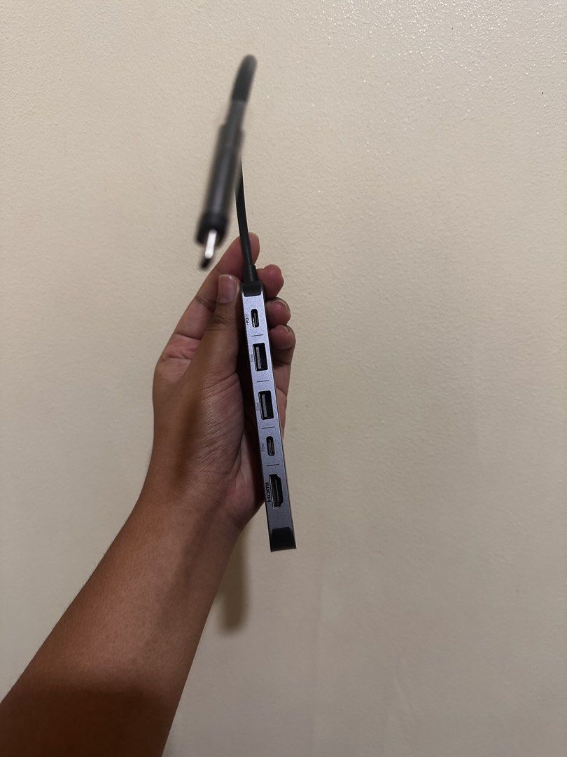 Anker USB-C Hub Multi-Port Adapter Grey Macbook Connector (Category: Cables & Adaptors) located in Cainta. Submitted by bangbangb (Listing ID 1470191890, Image 2). Description: - Brand: Anker USB-C Hub - Color: Dark grey with a compact aluminum body - 7 Ports: 2 USB, 1 HDMI, 1 SD card slot, 1 Power Delivery (PD), 1 Type C, 1 TF - Connection: Attached cable with USB-C connector - Condition: Clean unit, works great, like new, no box - Bought for Ph
