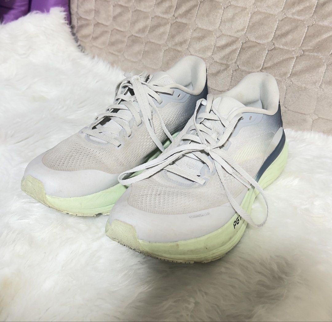 ANTA PG7 Travel 2 Running Shoes (Category: Sneakers) located in Las Pinas. Submitted by sugaaarr (Listing ID 1470265401, Image 2). Description: - Brand/Model: ANTA PG7 Running Shoes - Color: Light grey with unique greenish soles - Size: US 9.5 / UK 8.5 / EUR 43 / CHN 270 - Condition: Gently worn, minor scuffs on sole edges from normal use - Features: Breathable mesh upper, lace-up front, structured heel support, lightweight build - Best for: Comf