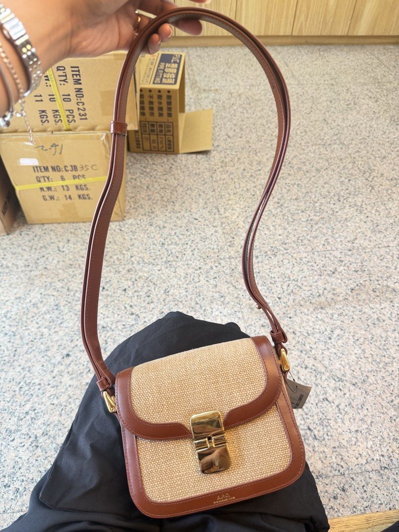 A.P.C. Brown Canvas Leather Flap Shoulder Bag (Category: Shoulder Bags) located in Caloocan City. Submitted by raminasanj77274 (Listing ID 1470246798, Image 2). Description: - Authentic A.P.C. shoulder bag crafted from premium brown leather and beige woven fabric - Elegant gold-tone hardware with a secure front flap clasp closure - Clean suede interior featuring multiple compartments and the iconic branded leather patch - Comfortable adjustable s