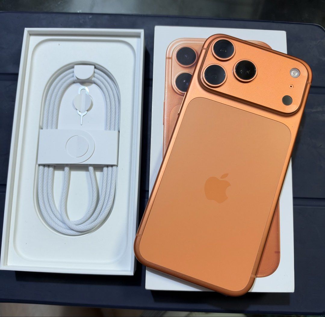 Apple iPhone (Category: iPhone 17 Series) located in Manila. Submitted by delacruzra58958 (Listing ID 1470330097, Image 1). Description: Iphone 17 pro max 256 GB Orange NTC / Openline Original box and acc 99% smooth No dents No issue / no repair 93% Batt Health Meet up pasig-ortigas-manda-eastwood .