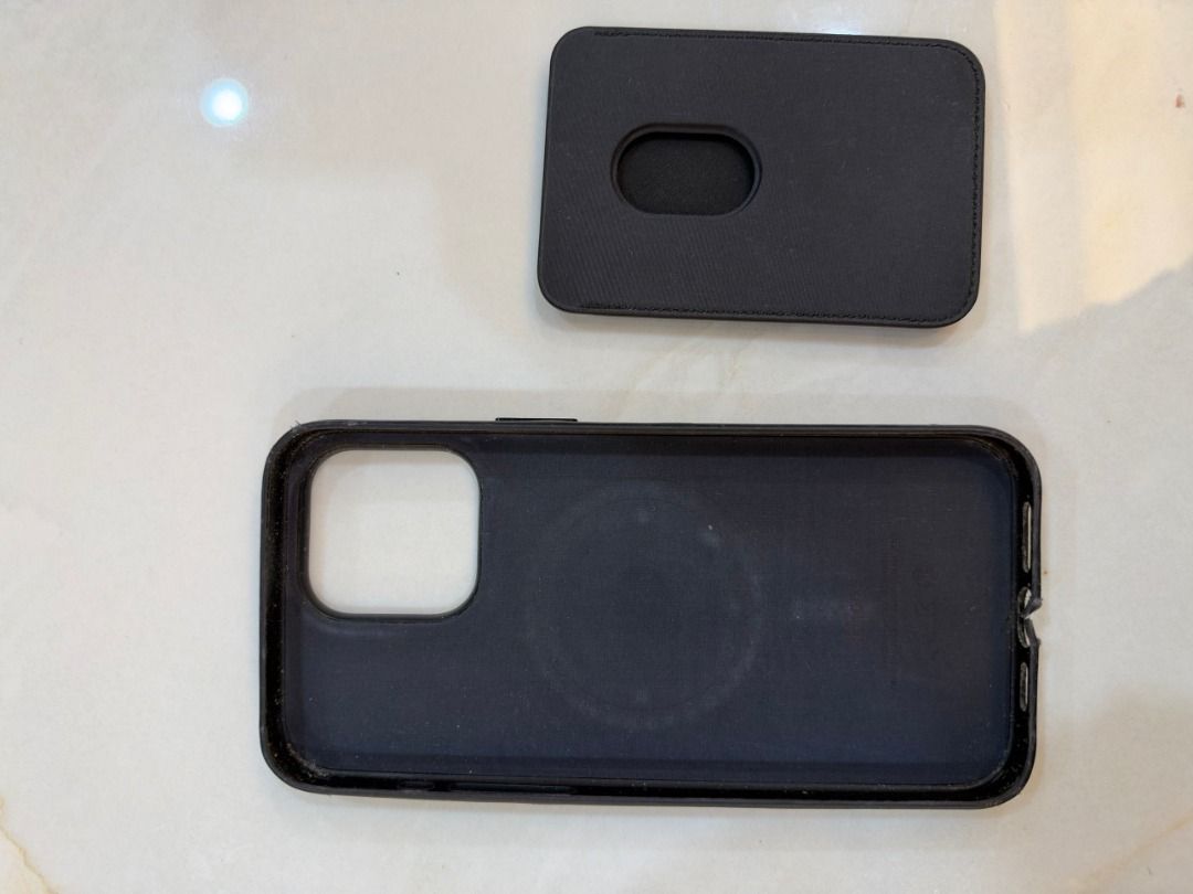 Apple iPhone Pro Max Leather Case MagSafe + Apple Leather Wallet (Authentic) (Category: Cases & Sleeves) located in Pasig City. Submitted by lhj0981olx (Listing ID 1470254186, Image 2). Description: For sale: Apple Leather Case with MagSafe for iPhone Pro Max + Apple Leather Wallet with MagSafe. 100% authentic Apple, black. Includes: - 1x Apple Leather Case with MagSafe (iPhone Pro Max) - 1x Apple Leather Wallet with MagSafe Condition: - Used, wi