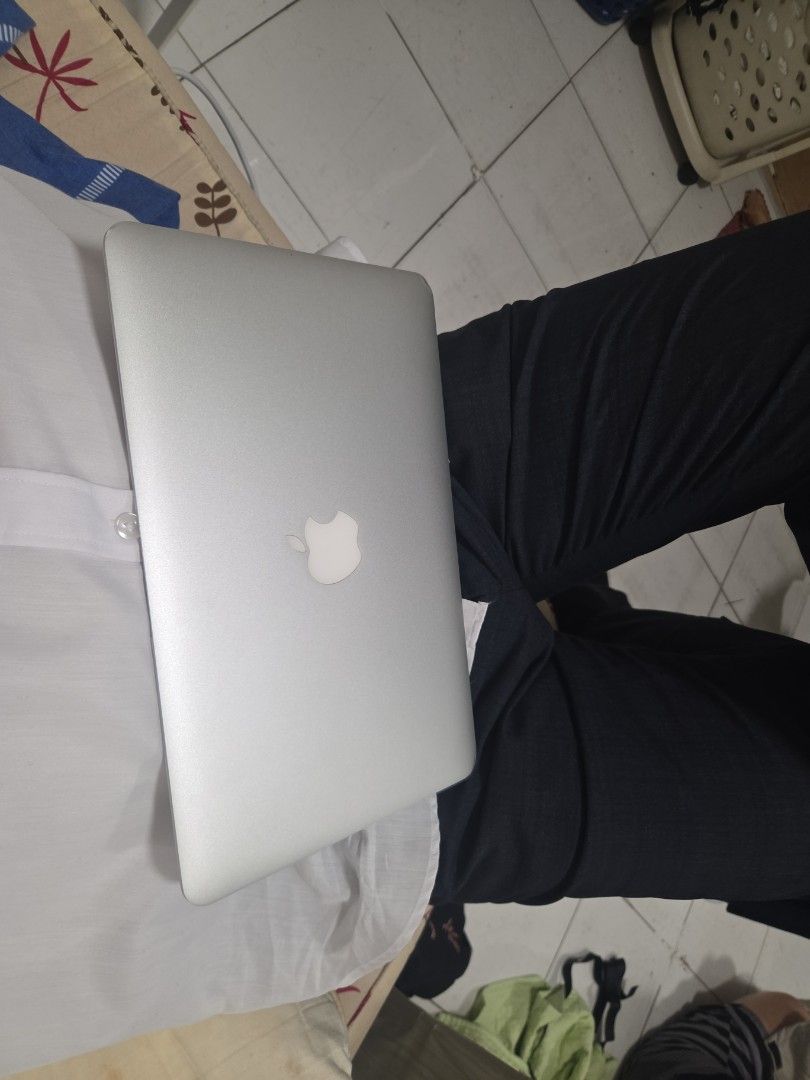 Apple MacBook Air Silver Laptop 2015 Version (Category: Laptops & Notebooks) located in Pasay City. Submitted by phillyp (Listing ID 1470301128, Image 1). Description: - Silver Apple laptop featuring the classic glowing logo - Compact and lightweight aluminum body for easy portability - Clean outer shell with minimal wear - Reliable battery that holds a good charge - Original charger included in the sale.