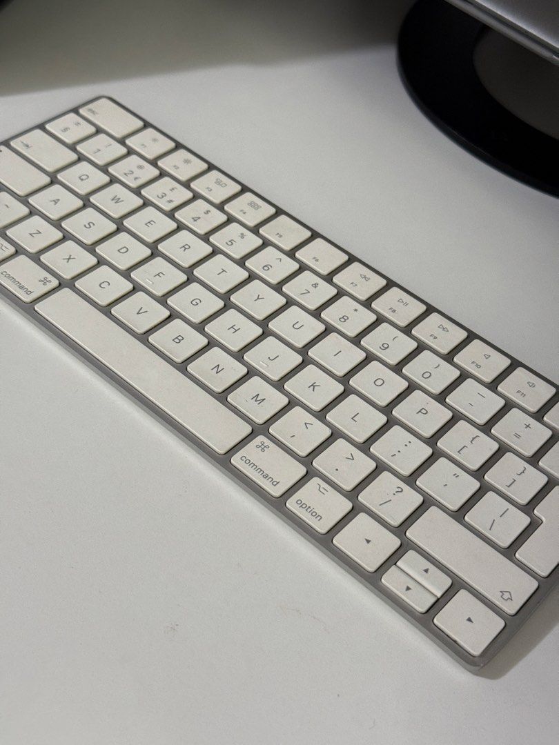 Apple Magic Keyboard with Numeric Keypad (Category: Computer Keyboard) located in Angeles City. Submitted by holyfabclothing (Listing ID 1470227995, Image 2). Description: - Genuine Apple Wireless Keyboard with full numeric keypad - Color: Silver and white - Layout: Standard UK layout with function keys - Connectivity: Bluetooth (compatible with Mac, iPad, and iPhone) - Battery: Built-in rechargeable .