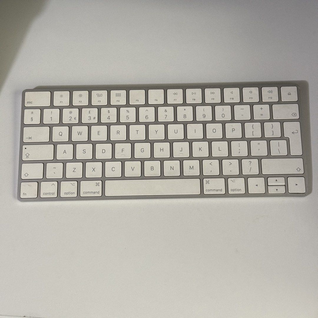Apple Magic Keyboard with Numeric Keypad (Category: Computer Keyboard) located in Angeles City. Submitted by holyfabclothing (Listing ID 1470227995, Image 1). Description: - Genuine Apple Wireless Keyboard with full numeric keypad - Color: Silver and white - Layout: Standard UK layout with function keys - Connectivity: Bluetooth (compatible with Mac, iPad, and iPhone) - Battery: Built-in rechargeable .