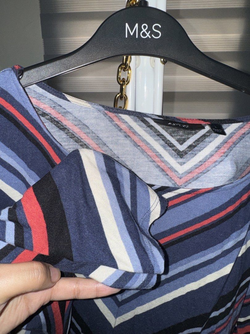 Apt. 9 Multi-color Striped Chevron Blouse Size L (Category: Blouses) located in La Trinidad. Submitted by prelovedandfindsbyji (Listing ID 1470235990, Image 3). Description: - Brand: Apt. 9 - Size: L - Pattern: Multi-color chevron stripes (blue, red, black, white) - Material: 100% rayon (lightweight and comfortable) - Style: Boat neckline, 3/4 sleeves, banded hem - Condition: Excellent, perfect for everyday wear.