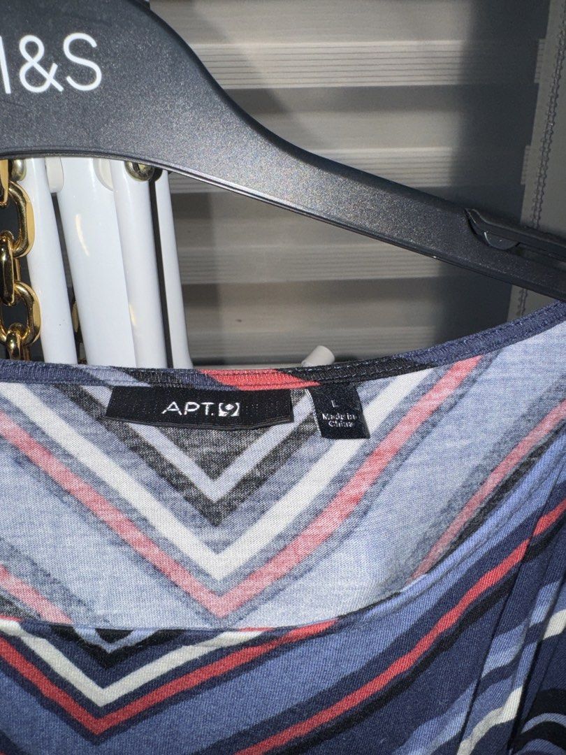 Apt. 9 Multi-color Striped Chevron Blouse Size L (Category: Blouses) located in La Trinidad. Submitted by prelovedandfindsbyji (Listing ID 1470235990, Image 2). Description: - Brand: Apt. 9 - Size: L - Pattern: Multi-color chevron stripes (blue, red, black, white) - Material: 100% rayon (lightweight and comfortable) - Style: Boat neckline, 3/4 sleeves, banded hem - Condition: Excellent, perfect for everyday wear.