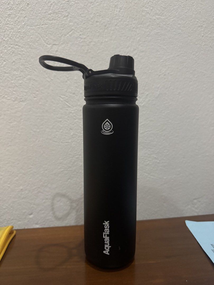 AquaFlask Black Insulated Water Bottle (Category: Water Bottles & Tumblers) located in Bacolod City. Submitted by swagspot (Listing ID 1470249879, Image 1). Description: - Brand: AquaFlask - Color: Matte Black - Lid Type: Standard mouth opening with black handle cap - Insulation: Double-wall vacuum insulated (keeps drinks cold for hours) - Design: Matte finish with white brand logo and water drop icon - Condition: Brand new - Perfect for daily us