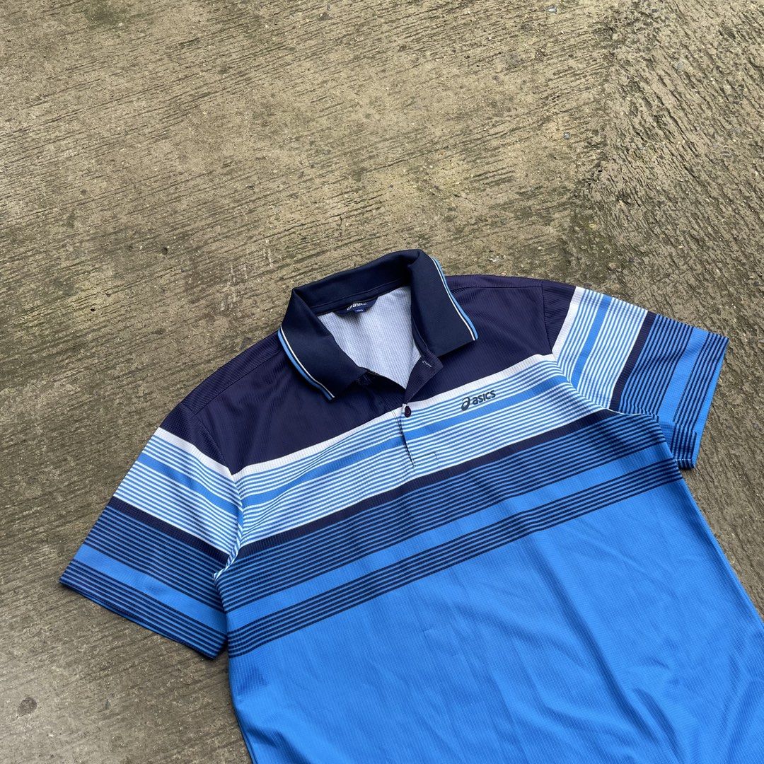 Asics Blue Striped Polo Shirt (Category: Tshirts & Polo Shirts ) located in Manila. Submitted by lawlaw21 (Listing ID 1470177930, Image 3). Description: - Brand: Asics - Color: Navy blue and bright blue with horizontal stripes - Size: 100 - Features: Polo collar, single button placket, lightweight athletic fabric - Perfect for active wear or smart-casual looks.