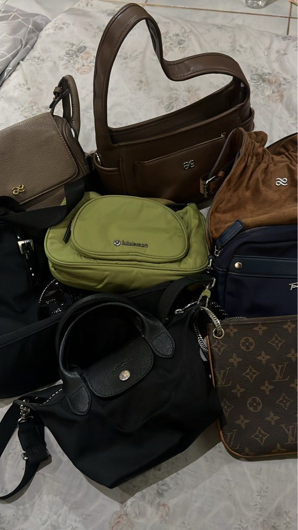 Assorted Designer and Everyday Handbags Collection (Category: Tote Bags) located in Kidapawan. Submitted by frizzyjayne (Listing ID 1470158295, Image 1). Description: - Curated bag bundle available as a set or separately - Includes brown leather shoulder bags, green Lululemon crossbody, and black Longchamp nylon tote - Features a luxury monogram Louis Vuitton pouch and versatile navy blue bags - Various styles available: bucket bags, satchels, an