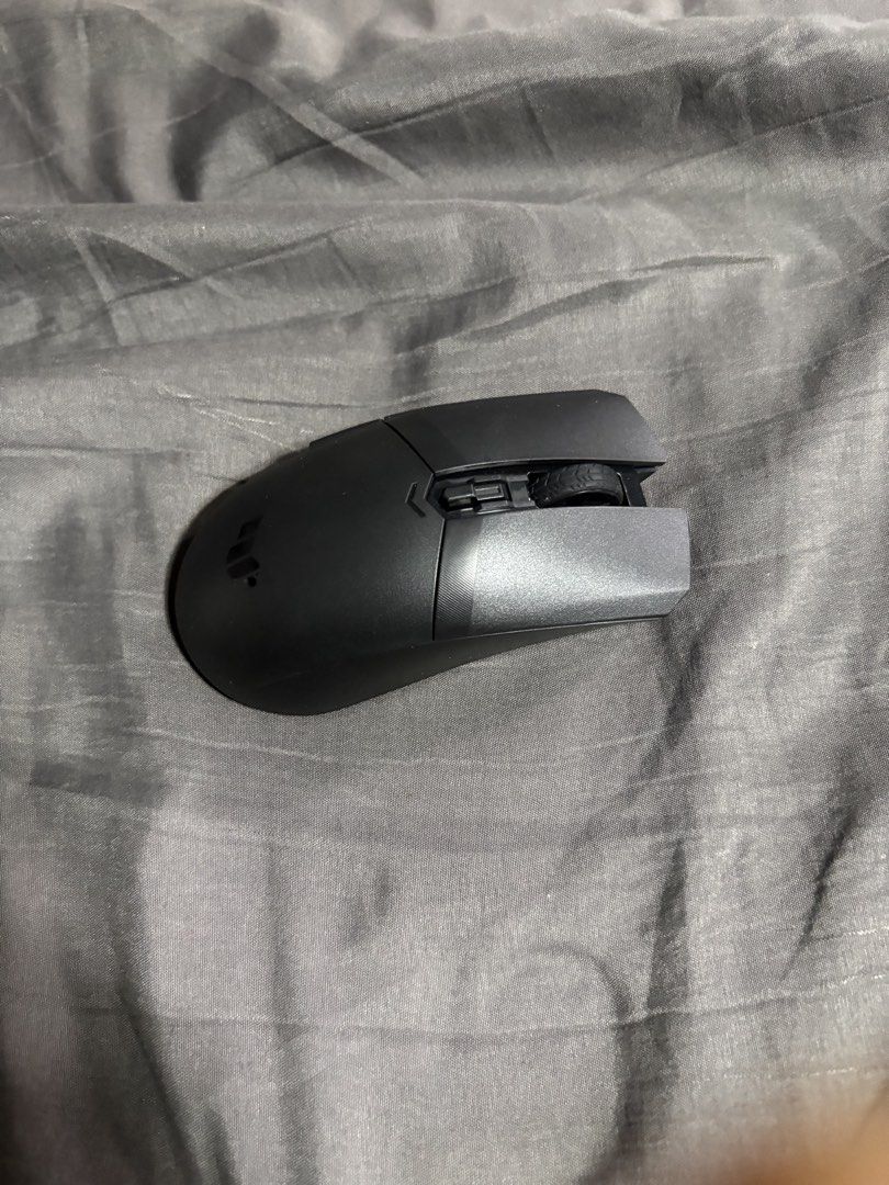 ASUS TUF Gaming M4 Wireless Mouse (Category: Mouse & Mousepads) located in Manila. Submitted by mortiv (Listing ID 1470181060, Image 2). Description: - Model: ASUS TUF Gaming M4 Wireless Optical Mouse - Connectivity: Dual wireless modes for versatile use - Build: Durable PBT top cover featuring an antibacterial guard - Design: Comfortable symmetrical ambidextrous grip - Inclusions: Original box, quick start guide, and batteries included - Conditi