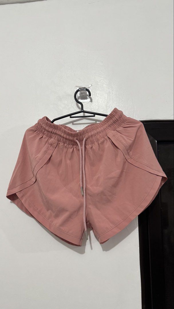 Athletic Running Shorts Bundle Black and Dusty Rose (Category: Shorts) located in Muntinlupa City. Submitted by maraaalpz (Listing ID 1470272232, Image 2). Description: - Set of 2 athletic shorts: Black and Dusty Rose Pink - Lightweight and breathable fabric for maximum comfort - Elastic waistband with matching adjustable drawstrings - Flattering curved hem design for easy movement - Perfect for gym workouts, runs, or lounging at home - Selling a