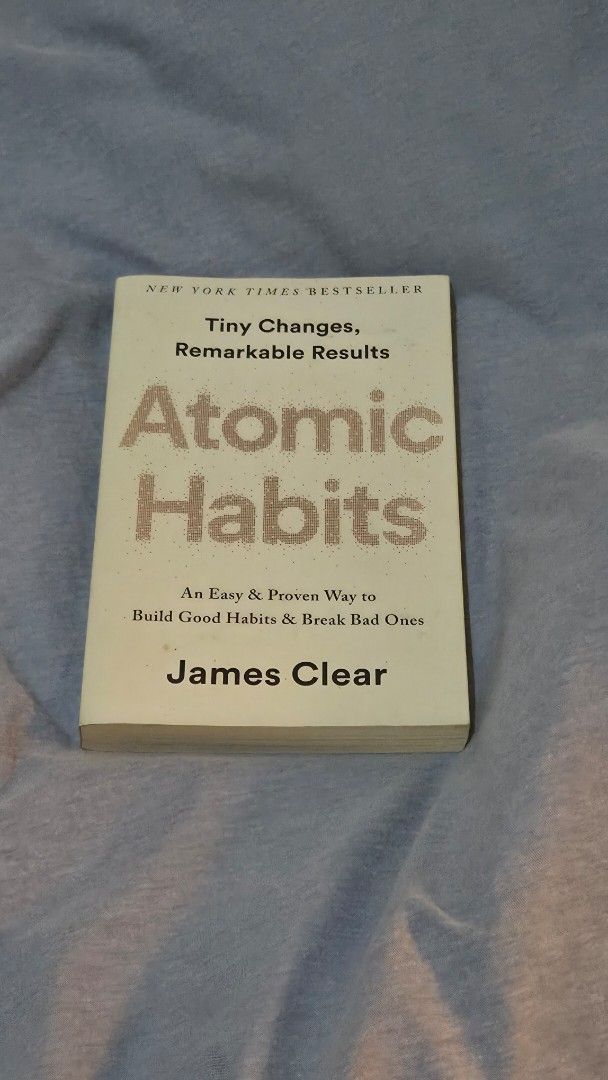 Atomic Habits by James Clear (Category: Storybooks) located in Muntinlupa City. Submitted by pearlbookstore (Listing ID 1470302935, Image 1). Description: - Title: Atomic Habits by James Clear - Format: Paperback edition with clear, readable text - Condition: Read once, very clean and tidy - Highlights: Bestselling guide on building good habits, breaking bad ones, and making tiny changes for remarkable results - Size: Standard size, easy to fit i