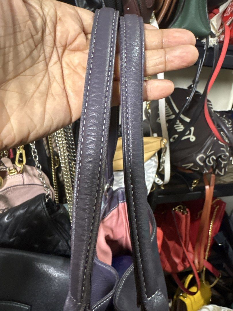 Auth Lanvin (Category: Shoulder Bags) located in Cordova. Submitted by cb_bagz_n_bloom (Listing ID 1470310831, Image 2). Description: Gorgeous dark purple leather shoulder bag with a slouchy shape and white contrast stitching. Features double straps, pebbled texture, and a chic Lanvin logo charm. Spacious interior for your daily essentials. Perfect for everyday use! PM for details..