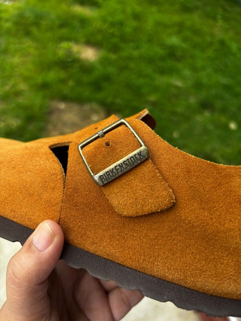 Authentic Birkenstock London Suede (Category: Flats & Sandals) located in Matalom. Submitted by eam_01 (Listing ID 1470161620, Image 3). Description: • Brand: Birkenstock • Model: London (Closed-Back Clog) • Size: EU 36 / US Women's 5-5.5 (230 mm) • Material: Premium Suede Leather Upper • Color: Mustard / Ochre / Warm Tan Condition Notes: • Uppers: Soft suede uppers are in good shape with typical light variations in texture from gentle wear. • Fo