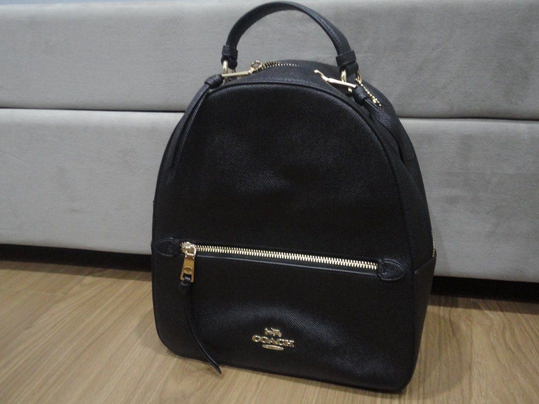 Authentic Coach Jordyn Black Leather Backpack (Category: Backpacks) located in Manila. Submitted by extras_bym (Listing ID 1470322397, Image 1). Description: - Brand: Coach - Material: Premium black pebble leather - Hardware: Elegant gold-tone hardware with gold logo plaque - Straps: Top handle and adjustable shoulder straps for comfort - Pockets: Front zippered pocket and main compartment with dual zip closure - Inclusions: Care booklet tag incl