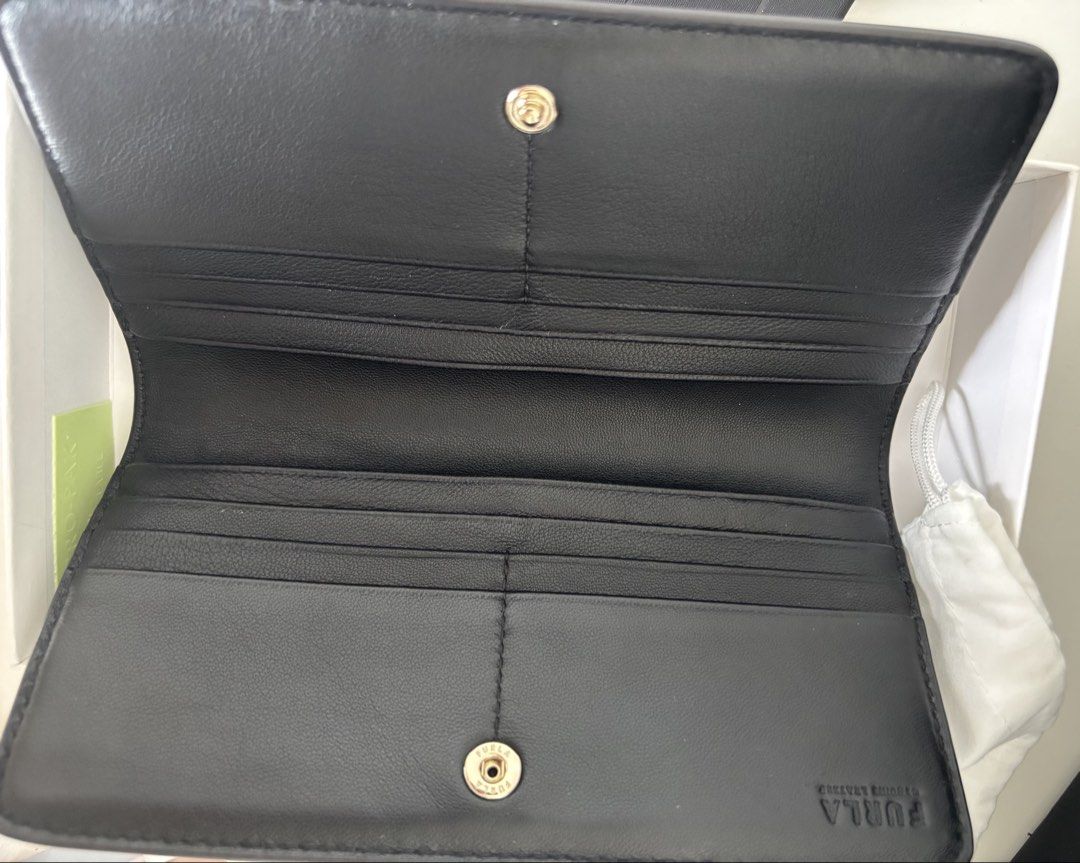 AUTHENTIC Furla Camelia XL Zip Around Slim Wallet (Category: Wallets & Card holders) located in Manila. Submitted by lxi16 (Listing ID 1470210744, Image 3). Description: - Brand: Furla - Material: Genuine black leather - Design: Slim zip-around with multiple card slots and compartments - Hardware: Elegant gold tone with front logo lettering - Condition: like new, used twice - Inclusions: Original box, tags, care booklet, and dust bag.