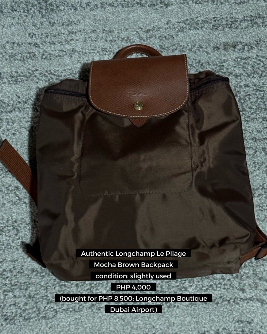 Authentic Longchamp Le Pliage Mocha Brown Backpack (Category: Backpacks) located in Manila. Submitted by mkyscloset (Listing ID 1470266843, Image 1). Description: - 100% Authentic Longchamp Le Pliage backpack in Mocha Brown - Bought from Longchamp Boutique at Dubai Airport (Original price: PHP 8,500) - Material: Durable nylon body with signature brown leather flap and handle - Hardware: Gold-tone - Features: Adjustable shoulder straps and secure 