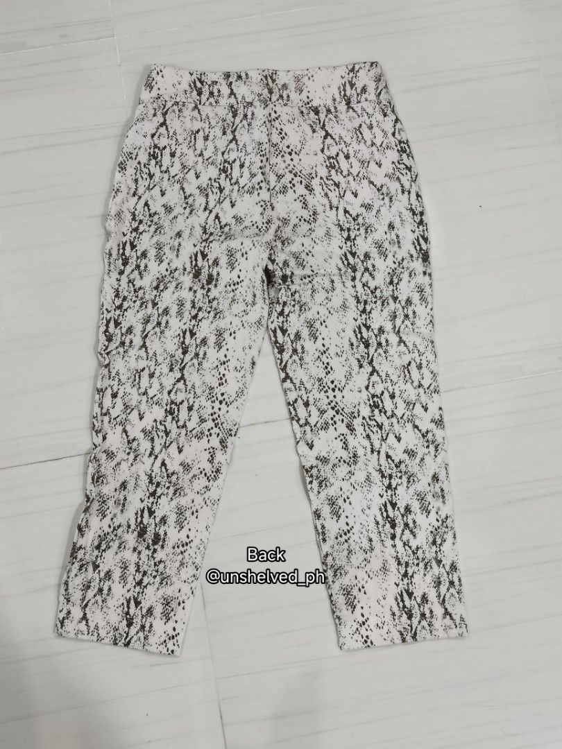 (AUTHENTIC) Premise Snakeskin Print Pants Size S (Category: Jeans) located in Trece Martires City. Submitted by unshelved_ph (Listing ID 1470209363, Image 3). Description: - Brand: Premise - Size: S - Pattern: Monochrome snake print - Design: Stretchable waistband with small metal hardware near the front pocket - Details: Clean interior branding tag - Styling: Perfect to pair with basic black or white tops - DM for more pics/vids if needed - CO t