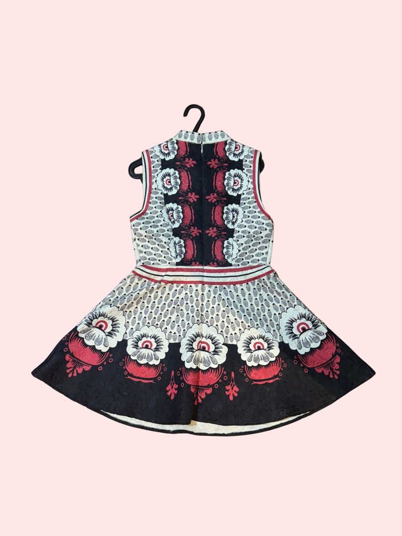Authentic Valentino Floral Mini Dress (Category: Dresses) located in Pasig City. Submitted by kia.sell (Listing ID 1470296422, Image 2). Description: - Brand: Valentino (100% Authentic) - Model: Folkloric Floral Bambolina Dress - Design: Sleeveless A-line skater silhouette featuring an intricate geo-mesh knit pattern, red-rimmed mock neck accents, and an ornate folkloric floral border print. - Material: Luxury knit blend - Condition: Excellent pr