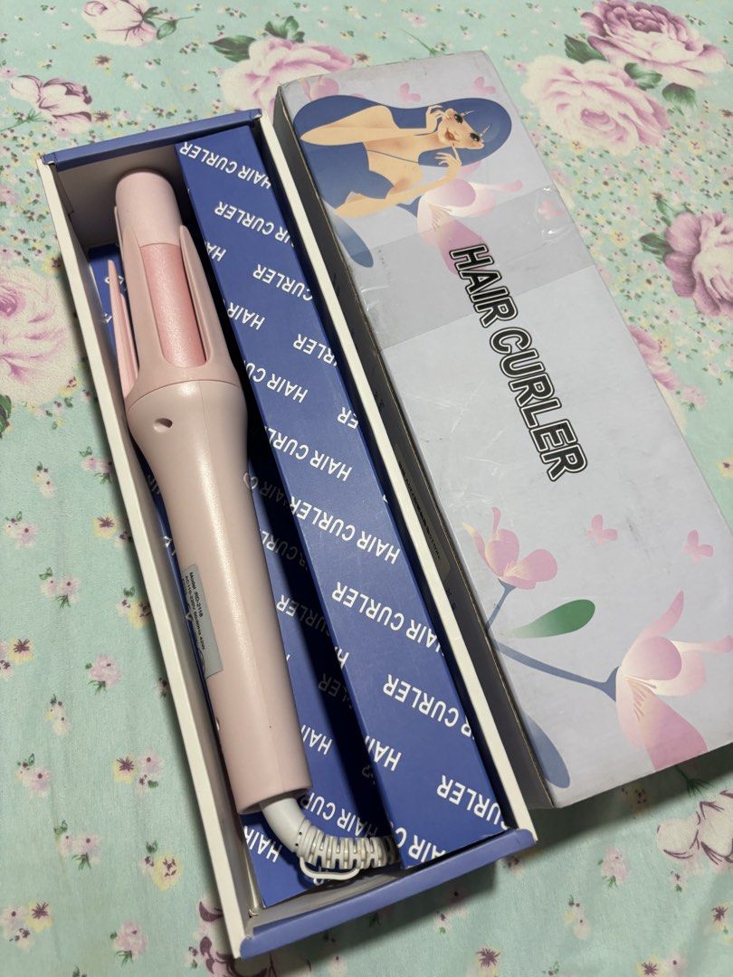 Automatic Hair Curler Pink Styling Tool with Box (Category: Hair) located in Quezon City. Submitted by ricalazo (Listing ID 1470178703, Image 2). Description: Automatic hair curler in soft pink. Model RD-2118, AC 110-220V. Temperature settings displayed on the handle. Includes original box and blue inner packaging. Great for styling waves and curls at home. Easy to use with directional buttons. Opened only. Never used since i have someone doing m