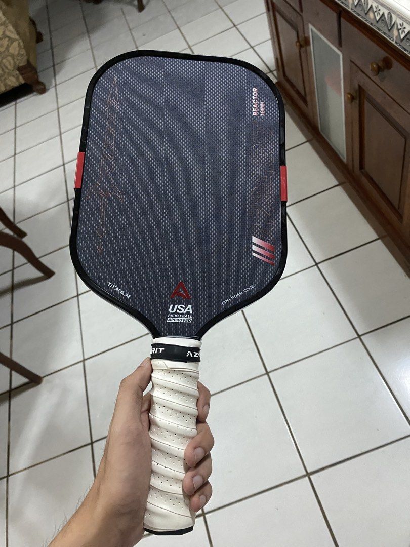 Azgairit Reactor 16mm Titanium Pickleball Paddle (Category: Racket and Ball Sports) located in Malaybalay. Submitted by wizophreniccc (Listing ID 1470304151, Image 2). Description: used once for an open play price is negotiable with box, eraser, and free overgrip.