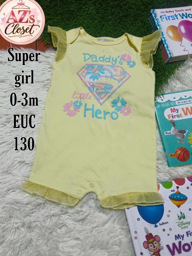 Baby Girl Clothes (Category: Babies & Kids Fashion) located in Manila. Submitted by clothingbyarnie (Listing ID 1470196999, Image 1). Description: - Design: 'Daddy's Little Hero' with a sparkly diamond graphic - Details: Adorable flutter sleeves and ruffle leg trim - Convenience: Bottom snap buttons for hassle-free diaper changes - Condition: Excellent, well-maintained.