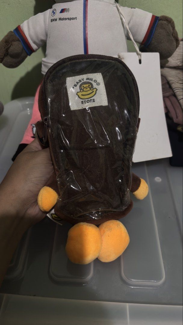Baby Milo Store brown monkey plush backpack bag (Category: Backpacks) located in Baguio. Submitted by iconicsmeti (Listing ID 1470236196, Image 2). Description: - Authentic Baby Milo Store brown monkey plush backpack - Made from ultra-soft, fuzzy material with a cute yellow face and paws - Convenient clear plastic zipper pocket on the back - Adjustable straps for a comfortable fit - Brand new with tag still attached on the side - A fun, stylish, 