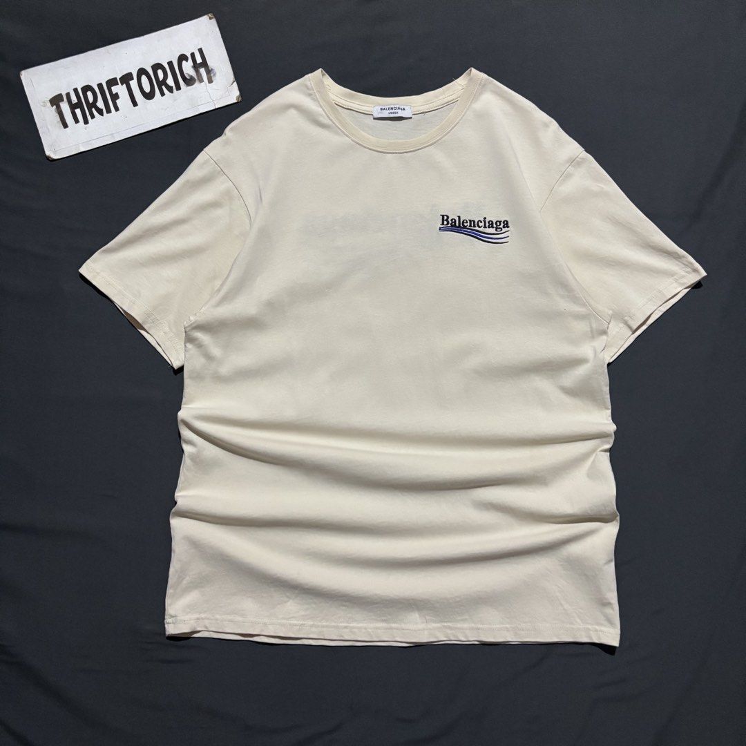 BALENCIAGA EMBROID SCRIPT KHAKI SHIRT (Category: Tshirts & Polo Shirts ) located in Taytay. Submitted by dwinsapparel (Listing ID 1470254532, Image 1). Description: BALENCIAGA EMBROID SCRIPT CREAM SHIRT W-22 L- 29 EXCELLENT CONDITION NEED WASH COMPLETE TAGS.