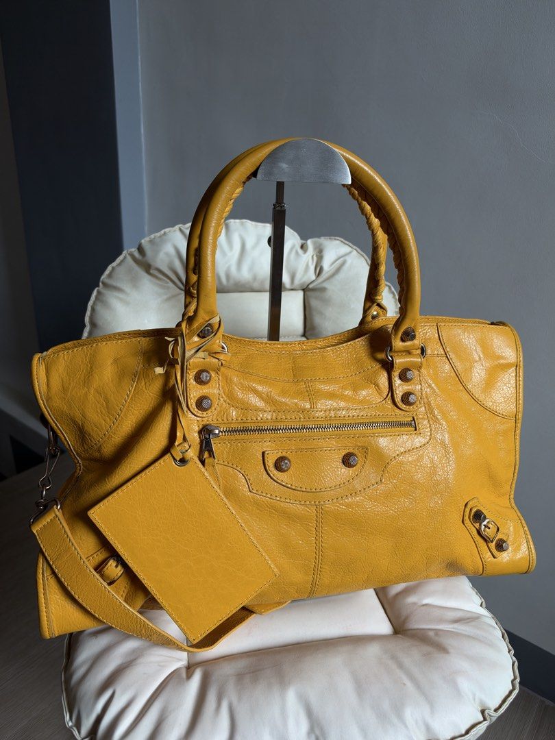 Balenciaga Mangue Part Time (Category: Luxury Bags & Wallets) located in Bacoor. Submitted by mikaysu (Listing ID 1470211748, Image 3). Description: A little piece of Balenciaga sunshine☀️✨ — 2012 Balenciaga Mangue Part Time Rosegold Hardware Condition: In excellent condition Minor rubs on the corners Inclusion: Bag, mirror, strap, controllato cards, sample leather, and dust bag.