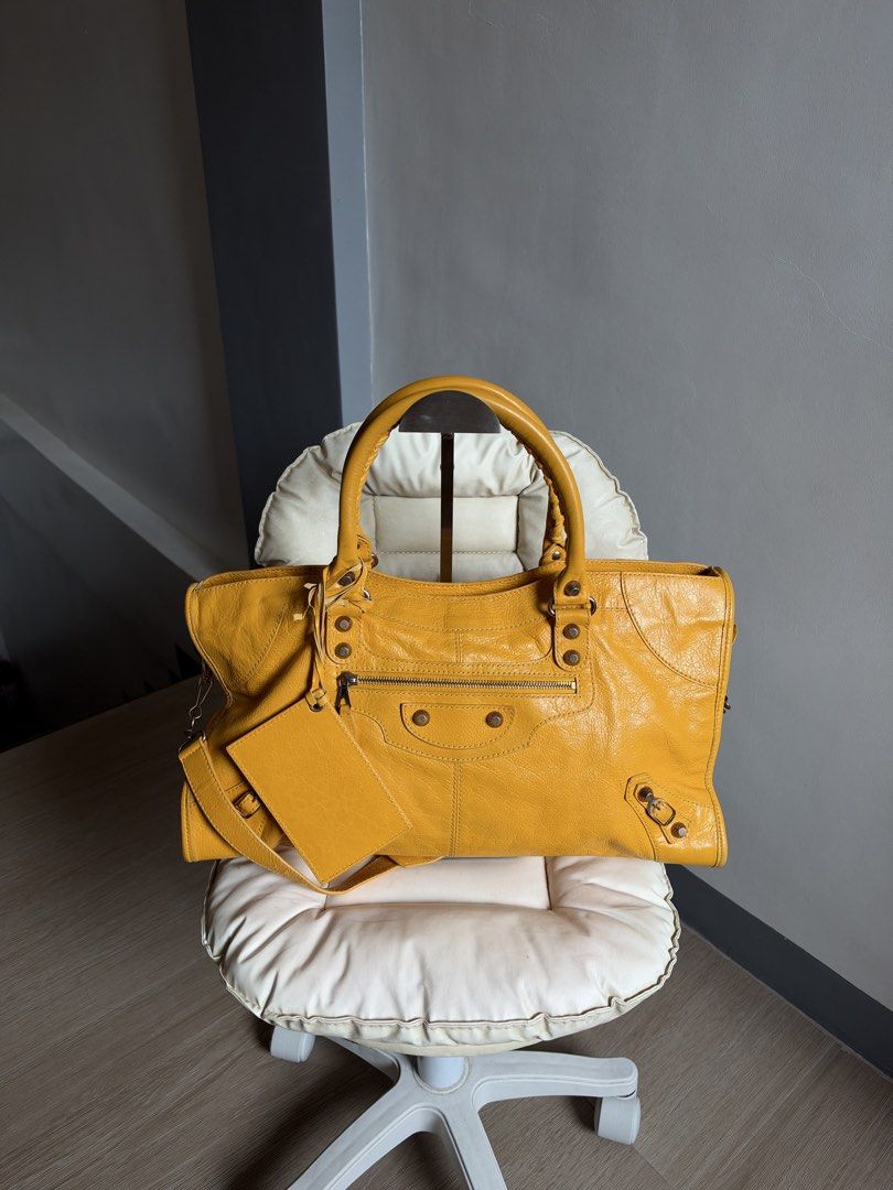 Balenciaga Mangue Part Time (Category: Luxury Bags & Wallets) located in Bacoor. Submitted by mikaysu (Listing ID 1470211748, Image 2). Description: A little piece of Balenciaga sunshine☀️✨ — 2012 Balenciaga Mangue Part Time Rosegold Hardware Condition: In excellent condition Minor rubs on the corners Inclusion: Bag, mirror, strap, controllato cards, sample leather, and dust bag.