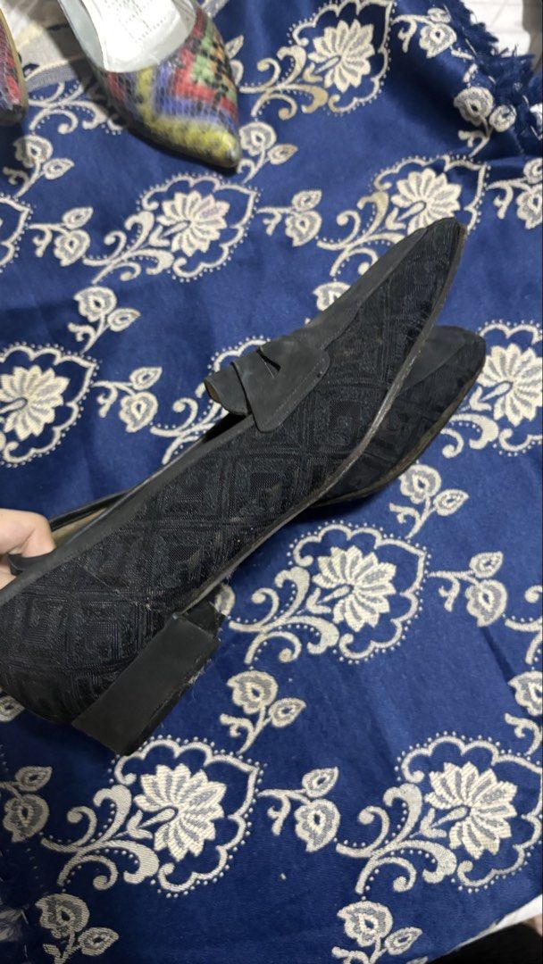 Bally Black Patterned Loafers (Category: Loafers) located in Makati City. Submitted by badbihswaggage (Listing ID 1470301985, Image 3). Description: - Brand: Bally - Style: Slip-on penny loafers with low block heel - Material: Textured diamond pattern upper with smooth leather trim - Color: Black with beige inner sole - Condition: Pre-owned with visible wear on insoles and soles - Features: Bally logo stamp on the right insole, everyday comfort d