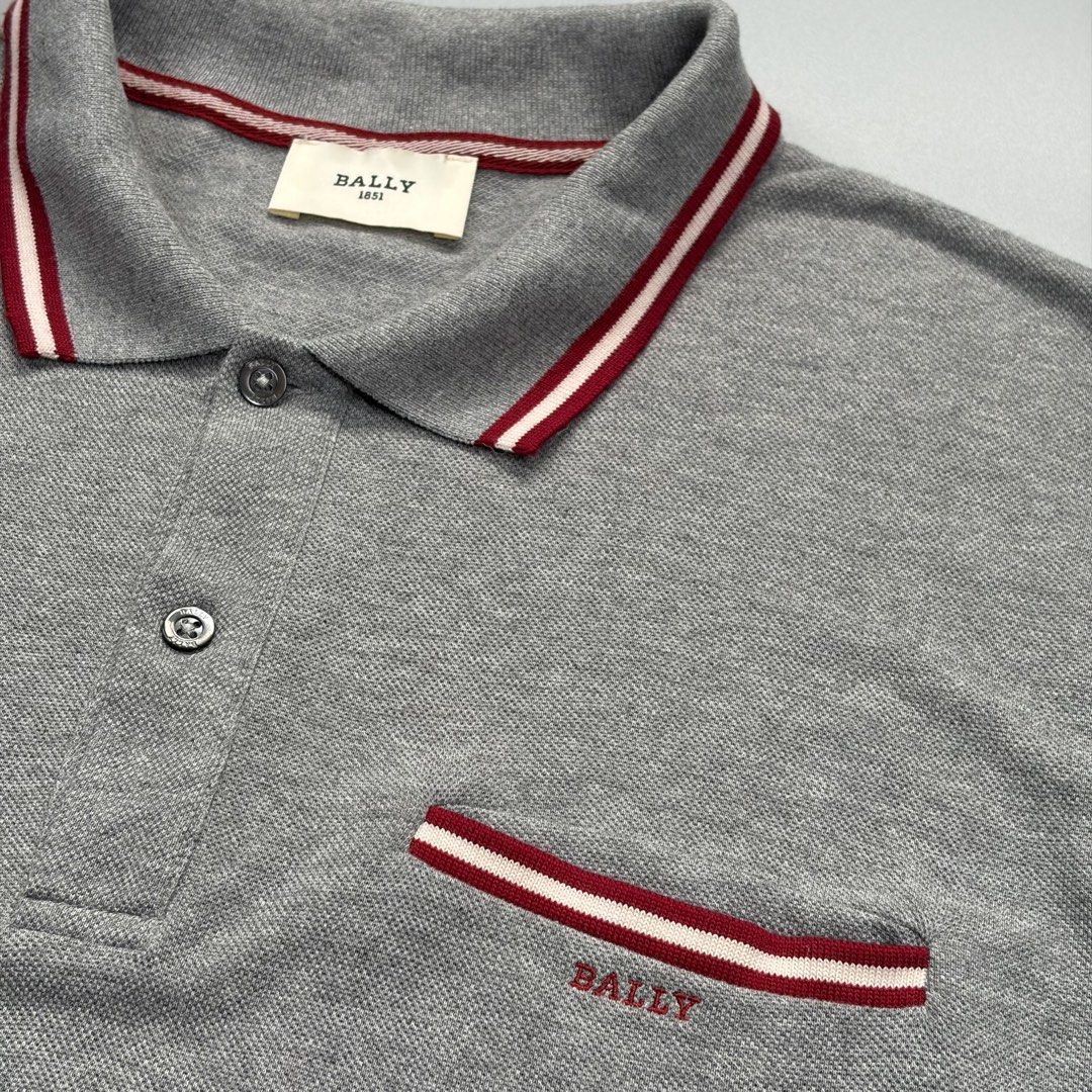 Bally Poloshirt (Authentic) (Category: Luxury Apparel) located in Cavite. Submitted by onebeancent (Listing ID 1470345436, Image 3). Description: Size: XL Dimension: 23" Width | 27" Length Color: Gray Color Rate: 10/10 Issue: None Condition: Like new‼️ Price: 1,480php Additional Shipping Fee (J&T Small Pouch) 75php Luzon 100php visayas 120php mindanao.