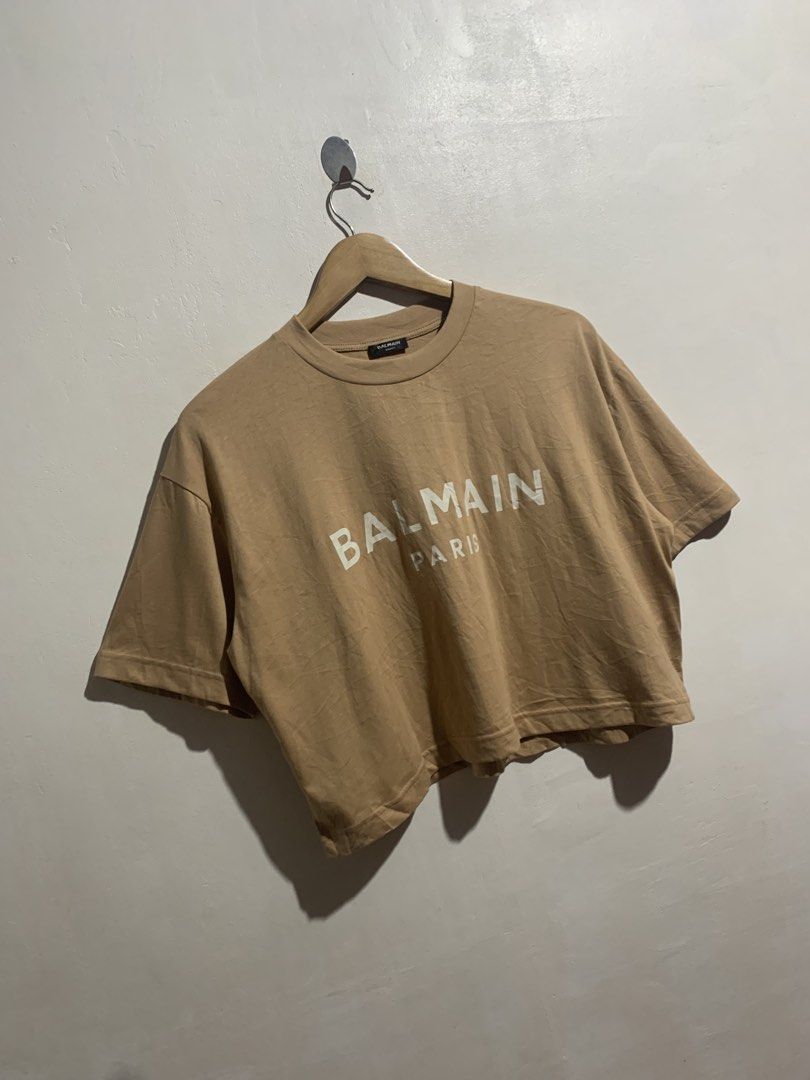 BALMAIN CROPPED TEE (Category: Others Tops) located in Gumaca. Submitted by getscore.ph (Listing ID 1470284723, Image 2). Description: WTS ❗️BALMAIN CROPPED TEE❗️ Sariwa✨ ✅Size: L on tag ✅Dimes: Width 22 Length 18.5 ✅Color Rate: 9.7/10 ✅Condition: Excellent ✅Issue: None Color may due to lightning NEED WASH FRESH FROM BALE DM ME TO PURCHASE 📥 📍Loc. Gumaca,Quezon 📍Courier: JNT EXPRESS.