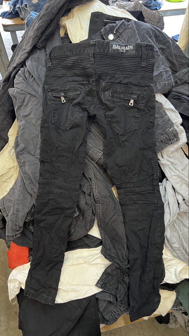 Balmain Paris Black Biker Jeans (Category: Jeans) located in Sagbayan (Borja). Submitted by thirftcartel (Listing ID 1470152162, Image 2). Description: - Brand: Balmain - Style: Black biker jeans with heavy moto aesthetic - Fit: Slim fit - Size: 25 (Tag indicated) - Material: Premium cotton denim - Key Features: Ribbed panels on knees and back waistband, functional zipped pockets on front and back - Care Instructions: Wash separately.