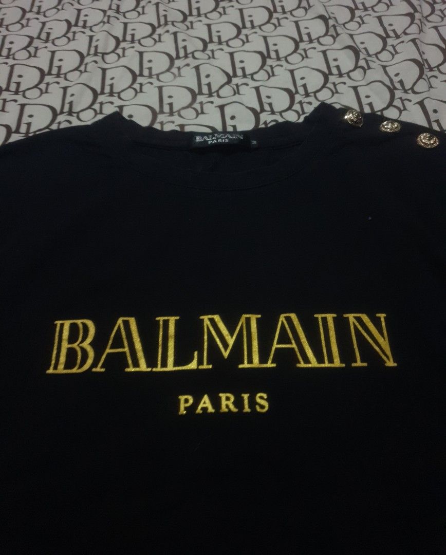 Balmain Paris tshirt (Category: Shirts) located in San Fernando. Submitted by retro.district. (Listing ID 1470346441, Image 2). Description: - Balmain Paris tshirt - Size: Medium(19x28) - Condition: Excellent - No issue - Color Rate: 9.5/10.