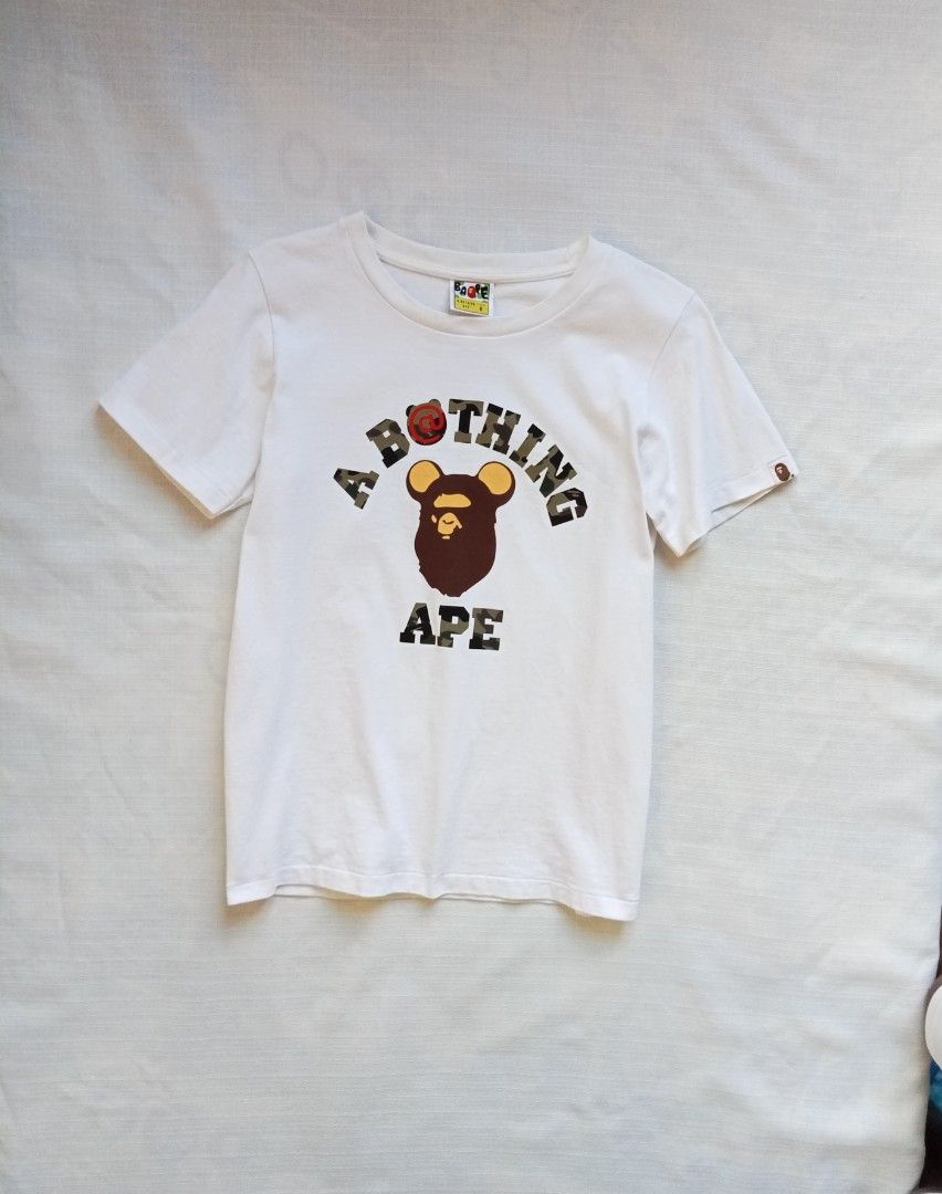 BAPE bearbrick collage tee for her (Category: Shirts) located in Bagabag. Submitted by thrift_stories96 (Listing ID 1470251854, Image 1). Description: BAPE bearbrick collage tee for her Small on tag fits medium Length - 25.5 Width - 18 Condition - excellent No flaw.