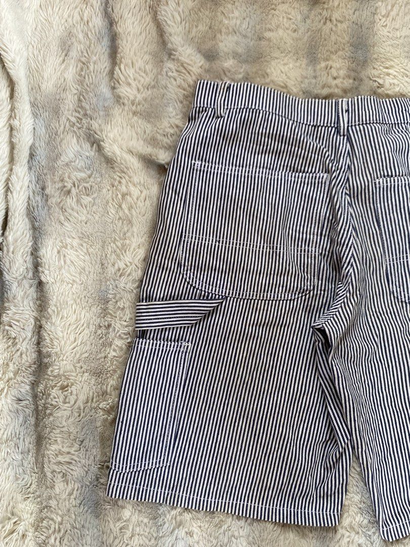 Base Control Blue White Striped Carpenter Shorts Size 30 (Category: Shorts) located in Andop. Submitted by safewater-895a (Listing ID 1470281972, Image 3). Description: - Brand: Base Control - Style: Carpenter shorts with blue and white hickory stripe pattern - Size: 30 (tagged on inner label) - Material: 100% cotton, machine washable - Features: Classic utility design, back pockets, and side hammer loop detail - Closure: Button closure with zip 