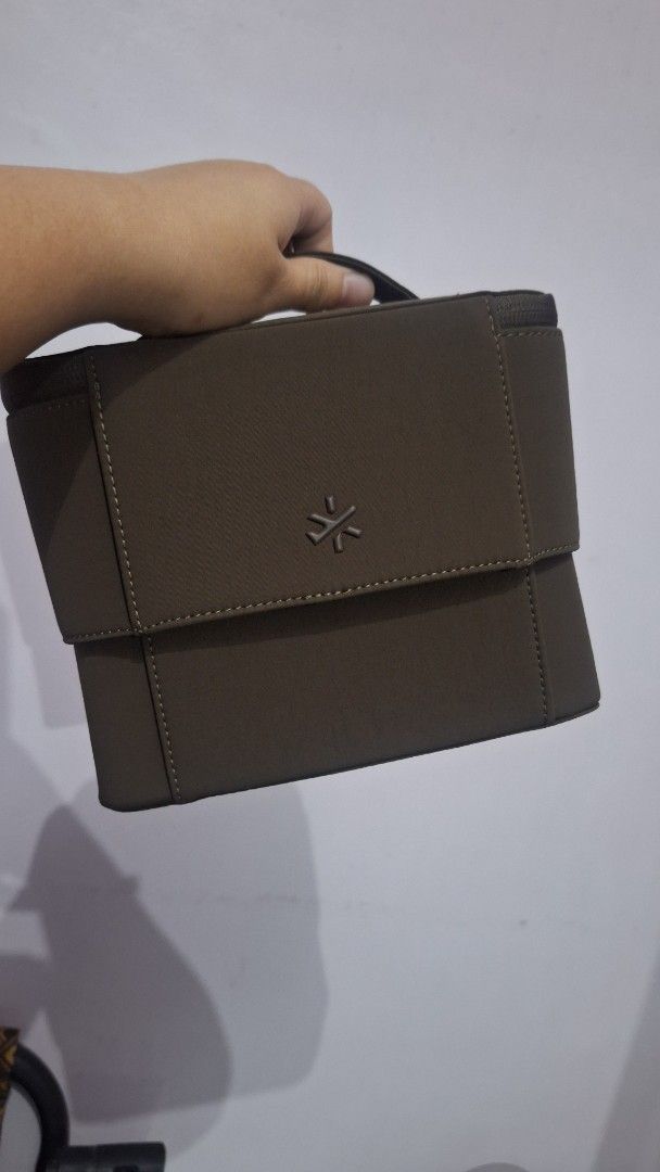 BASH flex organizer (Category: Accessory Holder, Box & Organizers) located in Caloocan City. Submitted by _mie3 (Listing ID 1470321840, Image 2). Description: - Brand: BASH manila - Color: Brown with clean dark brown interior lining - Structure: Sturdy, structured shape with a convenient side handle - Closures: Dual zipper opening with custom metallic pulls.