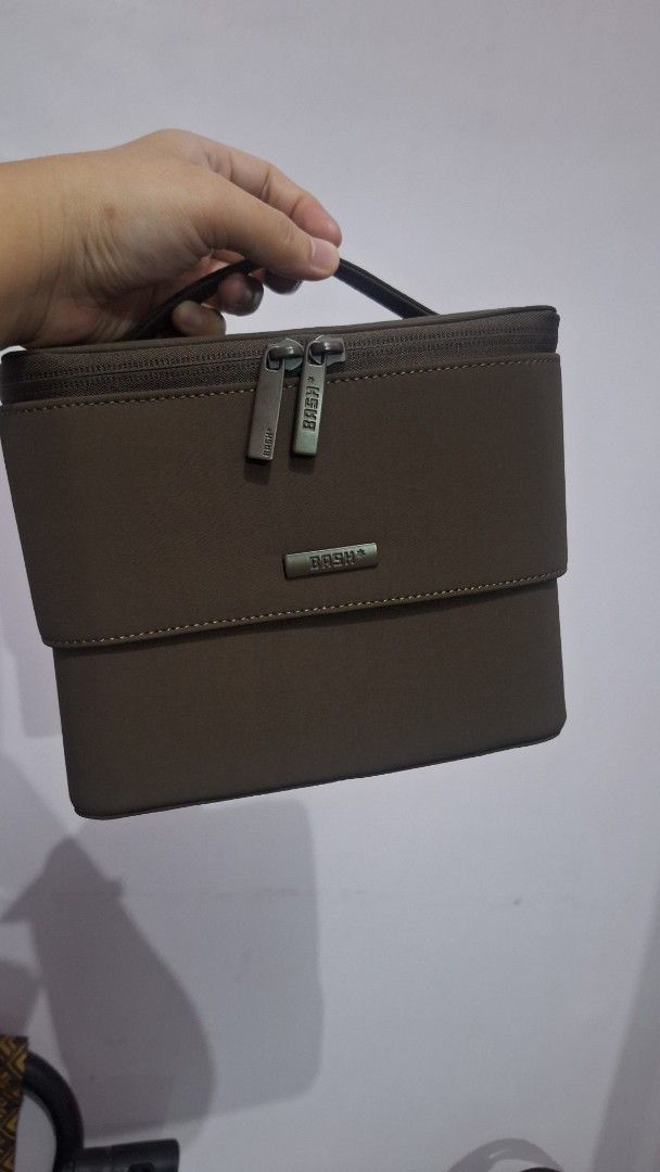 BASH flex organizer (Category: Accessory Holder, Box & Organizers) located in Caloocan City. Submitted by _mie3 (Listing ID 1470321840, Image 1). Description: - Brand: BASH manila - Color: Brown with clean dark brown interior lining - Structure: Sturdy, structured shape with a convenient side handle - Closures: Dual zipper opening with custom metallic pulls.