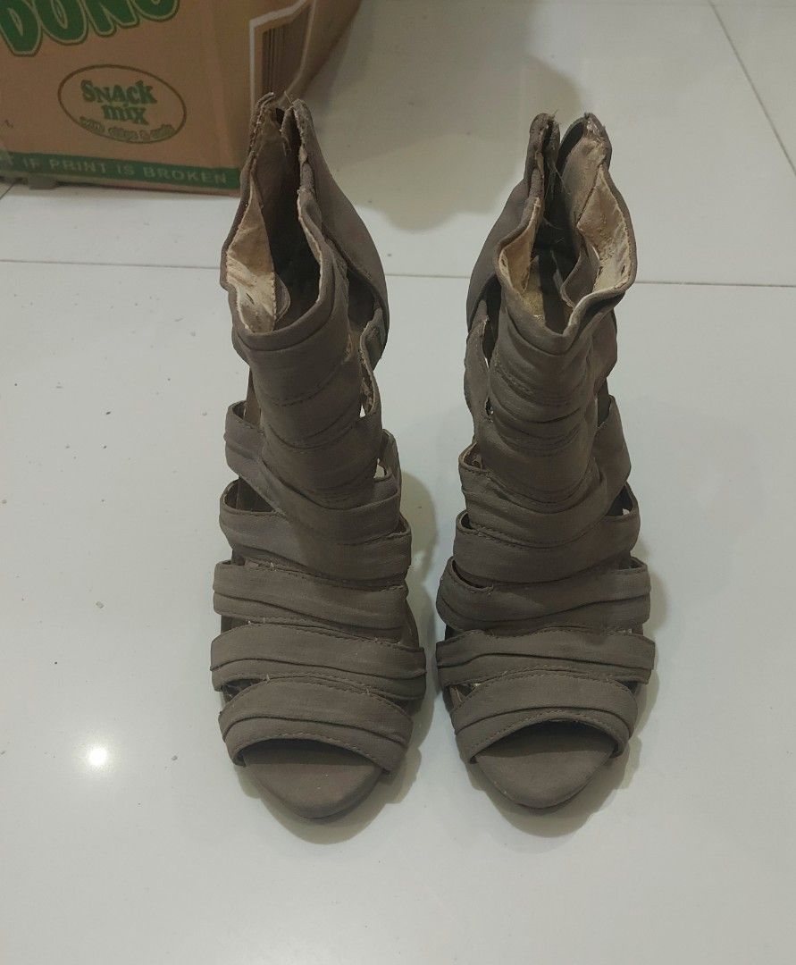 BCBGeneration Caged Stiletto Booties (Taupe, Size 6.5) (Category: Boots) located in Pateros City. Submitted by foryoufindsph (Listing ID 1470214997, Image 2). Description: BCBGeneration Caged Stiletto Booties (Taupe, Size 6.5) ​₱499 ONLY! (Slightly negotiable for fast deals) ​Add an instant edge to your outfit with these gorgeous caged stiletto heels from BCBGeneration! Features a chic strappy design, open toe, and a sleek back-zipper closure for