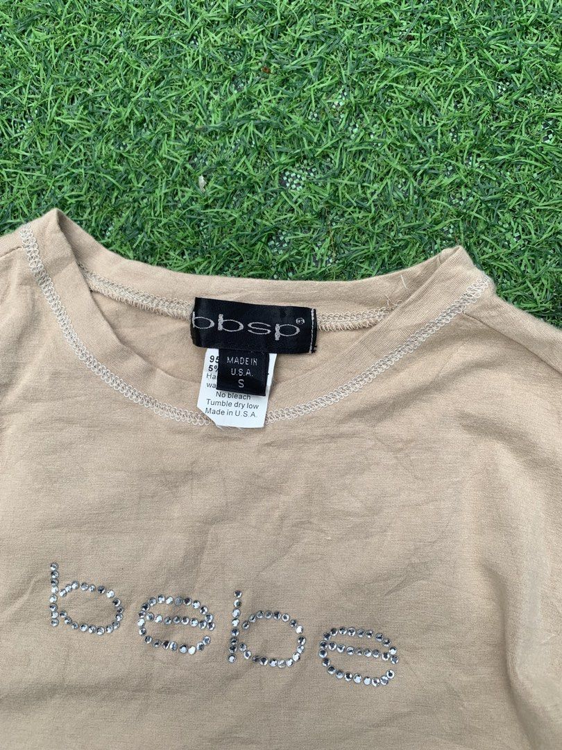 BEBE 2000s RHINESTONE 3/4 SLEEVE TOP (Category: Others Tops) located in Davao. Submitted by thrift_cuttiiee1000 (Listing ID 1470264915, Image 2). Description: Bebe 2000s Rhinestone 3/4 Sleeve Top Bebe defined late 1990s and early 2000s mall-glam fashion, known especially for its rhinestone-embellished logo tops and fitted silhouettes. This piece hails from the brand’s ‘bbsp’ (Bebe Sport) diffusion line, manufactured domestically in the United Sta