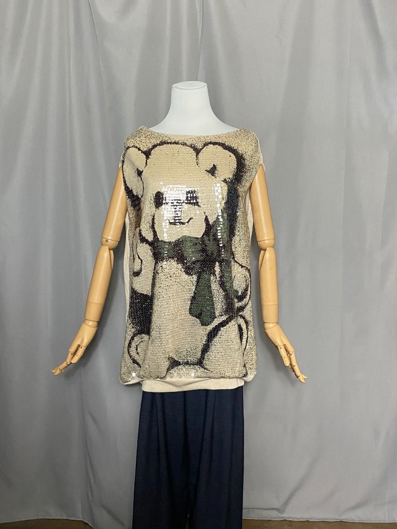 Beige bear sequined top (Category: Shirts) located in Las Pinas. Submitted by ipickyou (Listing ID 1470287965, Image 2). Description: Unwashed Condition: 10/10 𝗠𝗲𝗮𝘀𝘂𝗿𝗲𝗺𝗲𝗻𝘁𝘀 𝘄𝗵𝗲𝗻 𝗹𝗮𝗶𝗱 𝗳𝗹𝗮𝘁: -Armpit to armpit: 20 1/2” -Length: 31” .
