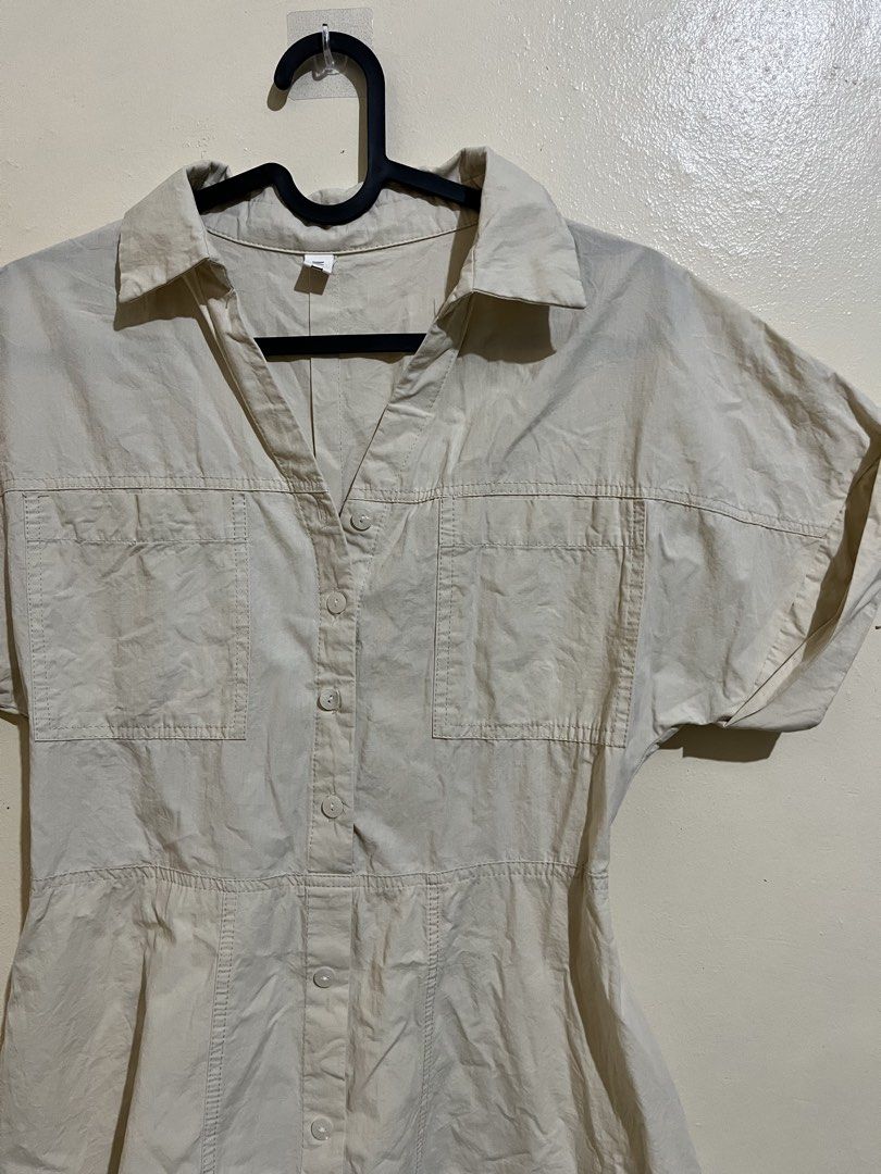 Beige Button-Front Shirt Dress with Pockets (Category: Dresses) located in Manila. Submitted by lovedbynixe (Listing ID 1470270665, Image 2). Description: Beige Button-Front Shirt Dress Small-med ₱180 Color: Versatile light beige neutral - Style: Utility-style shirt dress with a flared skirt and inner lining - Details: Collared neckline, front button closure to the waist, and two chest pockets - Fit: Cinched waistline with a knee-length cut (vari