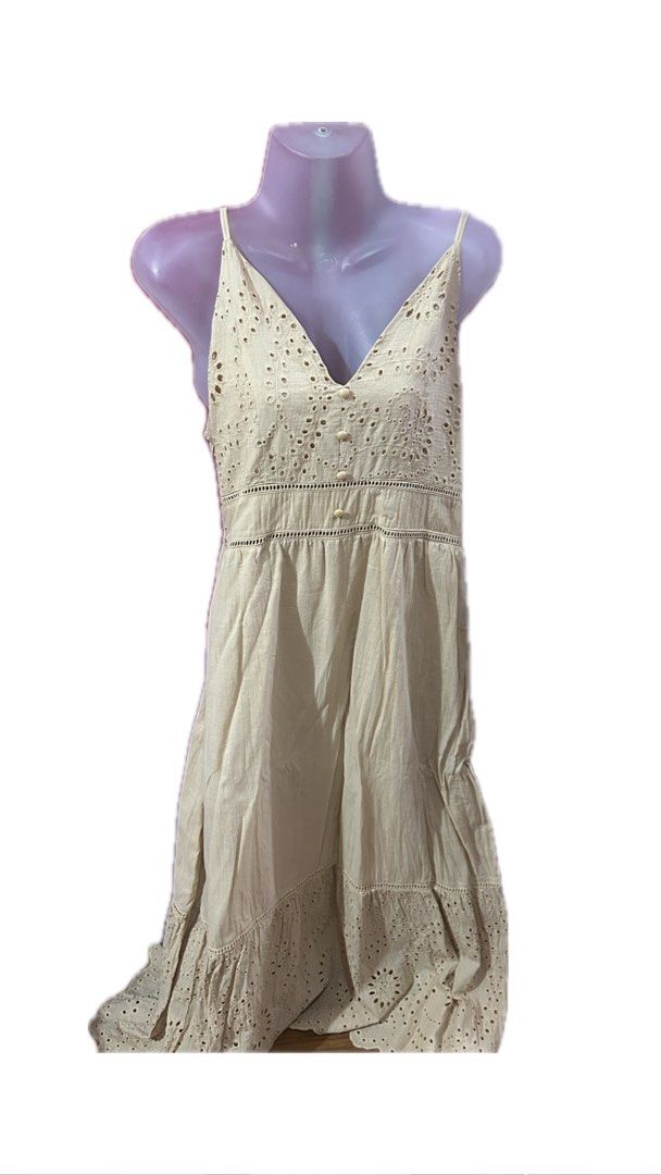 Beige Eyelet Embroidered Spaghetti Strap Sundress (Category: Dresses) located in Marilao. Submitted by bamito (Listing ID 1470166879, Image 1). Description: - Style: Beige midi dress with relaxed fit - Details: Intricate eyelet embroidery on bodice and hem, center front button closures - Fabric: Lightweight and breathable cotton.