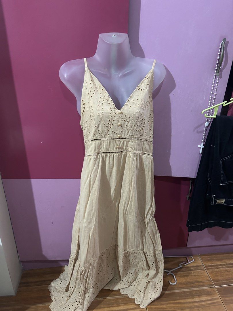 Beige Eyelet Embroidered Spaghetti Strap Sundress (Category: Dresses) located in Marilao. Submitted by bamito (Listing ID 1470166879, Image 2). Description: - Style: Beige midi dress with relaxed fit - Details: Intricate eyelet embroidery on bodice and hem, center front button closures - Fabric: Lightweight and breathable cotton.