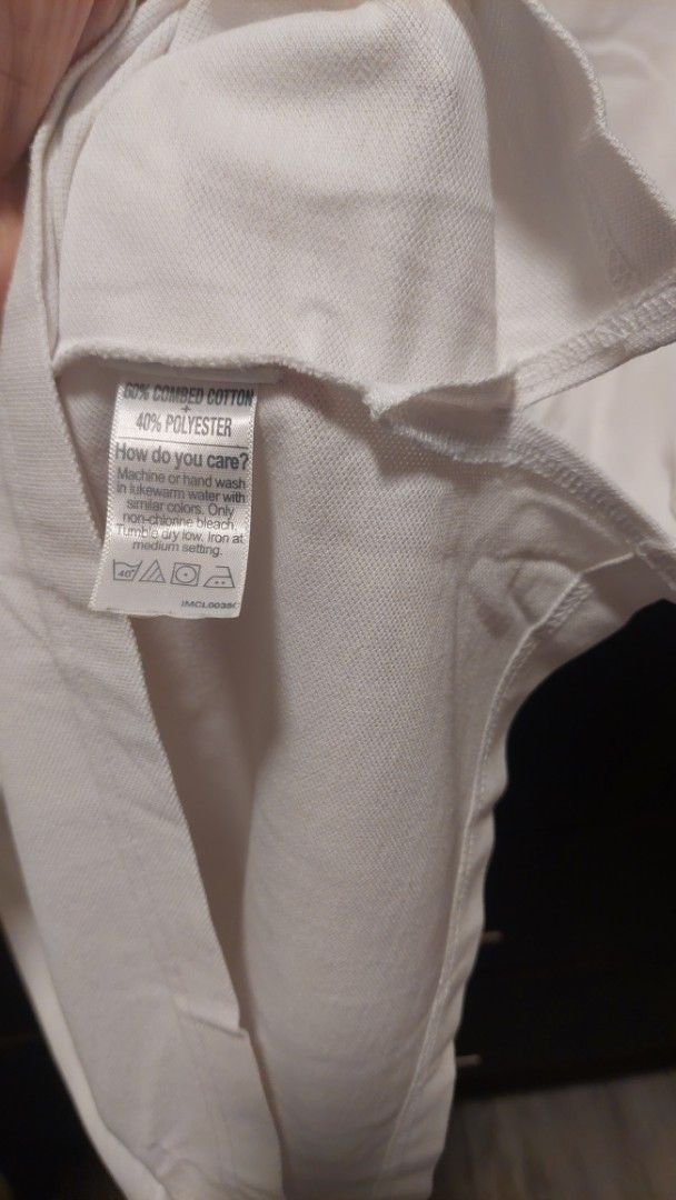 Bench white polo shirt with crest patch size S (Category: Tshirts & Polo Shirts ) located in Paranaque City. Submitted by daddyu (Listing ID 1470177142, Image 3). Description: - Brand: Bench - Size: S - Material: 60% combed cotton, 40% polyester - Color: Solid white - Design: Short sleeves, classic collar, three-button placket, large embroidered heraldic crest patch on chest - Details: Ribbed cuffs and collar, fabric care tag inside - Style: Comf