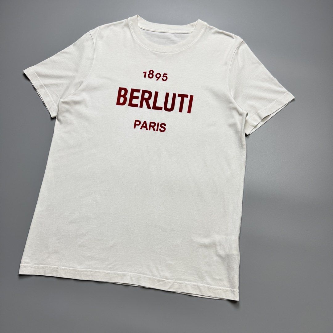 Berluti - Red Logo Cotton Tshirt (Category: Luxury Apparel) located in Quezon City. Submitted by japon_rose (Listing ID 1470221233, Image 2). Description: READ DESCRIPTION FIRST BEFORE YOU START A DEAL Please do self authenticate all photos are been posted Mens/ Berluti - Red Logo Cotton Tshirt Color: White Size: Large on tag (Mens) Length: 28 Width: 20 Shoulder: 16.5 Sleeves: 8 Hem: 20.5 (MEASURED IT BY INCHES) 9.5/10 overall condition In excell