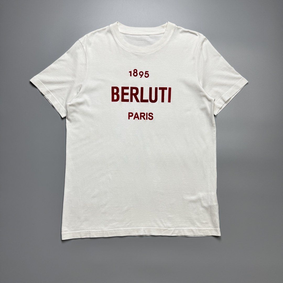 Berluti - Red Logo Cotton Tshirt (Category: Luxury Apparel) located in Quezon City. Submitted by japon_rose (Listing ID 1470221233, Image 1). Description: READ DESCRIPTION FIRST BEFORE YOU START A DEAL Please do self authenticate all photos are been posted Mens/ Berluti - Red Logo Cotton Tshirt Color: White Size: Large on tag (Mens) Length: 28 Width: 20 Shoulder: 16.5 Sleeves: 8 Hem: 20.5 (MEASURED IT BY INCHES) 9.5/10 overall condition In excell